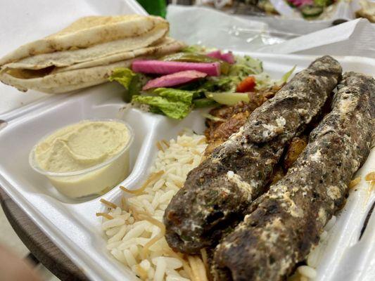 Kufta, Platter with hummus, Fattoush salad, lemony, potatoes, and rice with vermicelli.