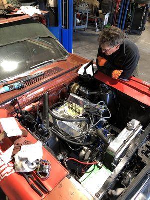 Danny from CK Auto showing me my new 302 installed in  my old 66 Mustang.