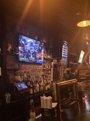 Inside at bar and lots of TVs