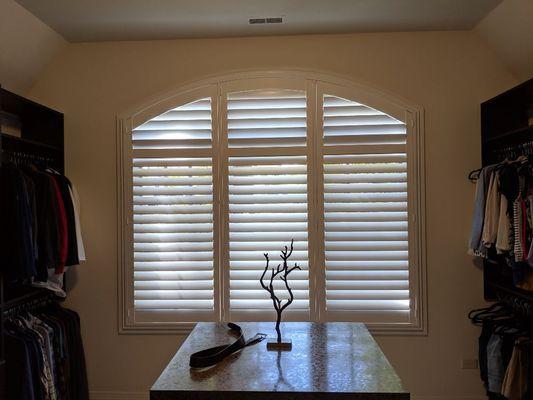 Specialty arch master closet shutter.