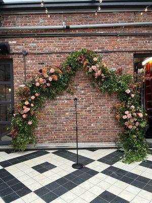 Wedding ceremony arch at Wythe Hotel, 2023