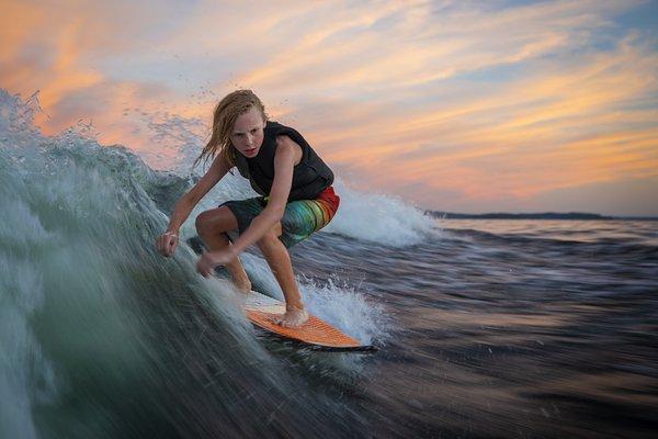 Our son getting the last surf of the day.