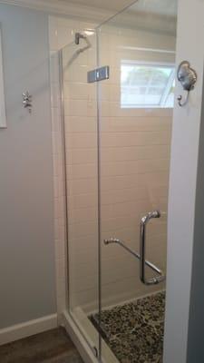 Installed specialty pivot shower door into a 48-inch walk in