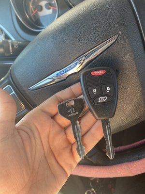 Silver key on the left is the brand new spare key they gave me for free , Large black key FOB on the right is the new key