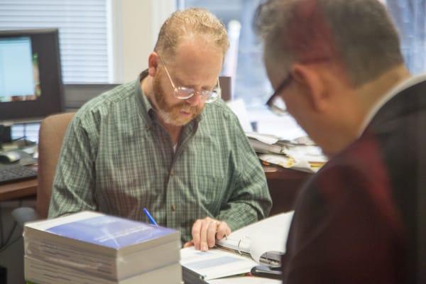 CPA's at work.  Partners Geoffrey Kulik and Charles Sterck work on a project.