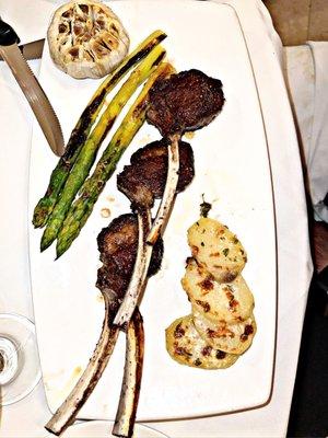 Agnello - Colorado lamb chops with roasted garlic and thyme sauce, with scalloped potatoes, roasted asparagus.