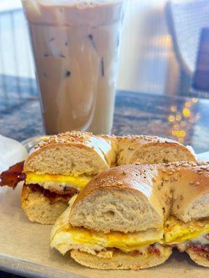 Crème brûlée latte and a bacon egg and cheese on a sesame bagel