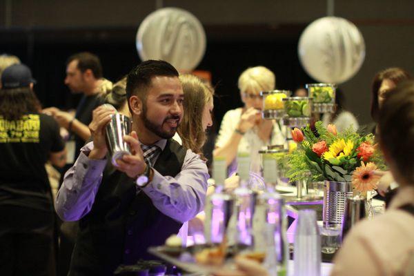 David Eclevia shaking up some samples for nearly 1,400 guests at the Center of Human Services' Edible Extravaganza. "Eat, Drink, Do Good."