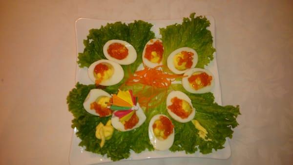 Stuffed eggs with red caviar