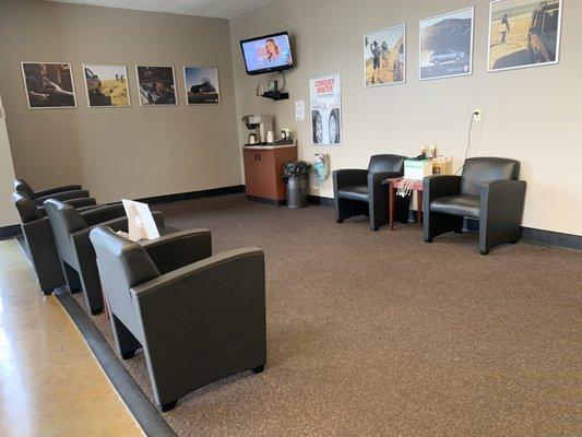 One of two waiting areas with coffee machine and DirectTV.