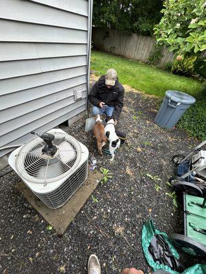 Our service tech Sam saying hello to a homeowners dogs.