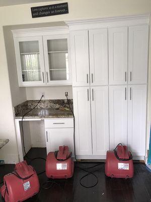 Drying under some kitchen cabinets.