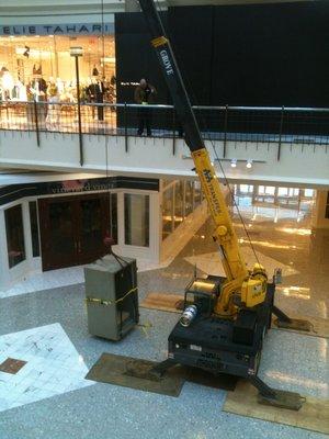 Crane 7000 lb safe onto 2nd level of mall.