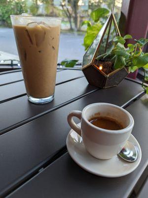 On the left is an iced chai and on the right is a double shot espresso.