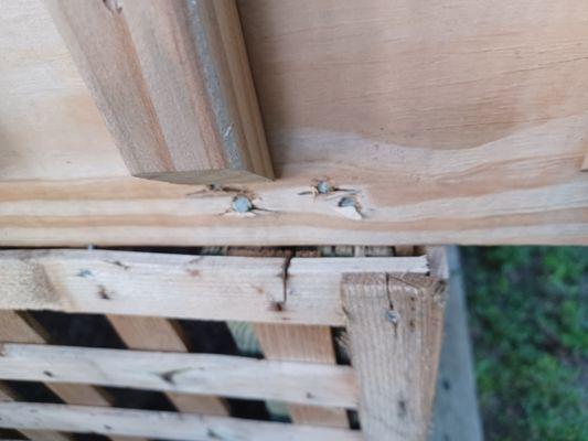 Exposed nails, split wood