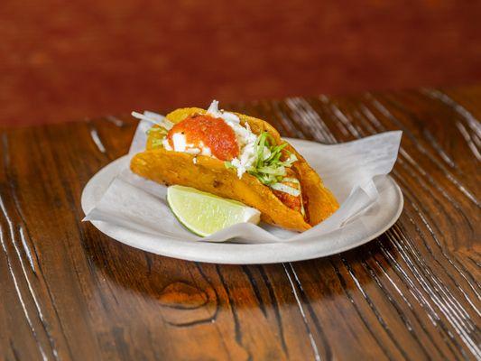 Crispy Tortilla with Chicken Tinga, Lettuce, Fresh Cheese, Sour Cream & Salsa Roja