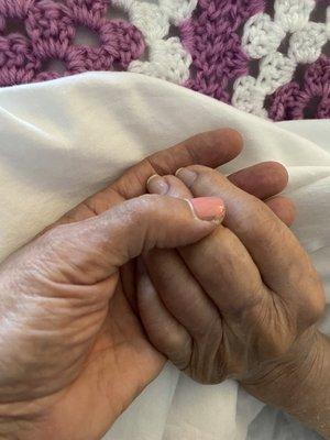 Holding hands with my mom at Heritage Hospice