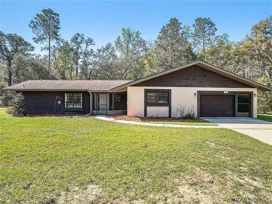 Our first house in Florida with our Agent Chaynne Carter and the Hardy Team