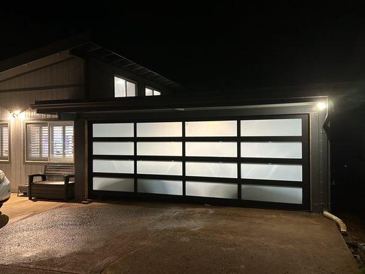 Full view garage door to let light in during the day.