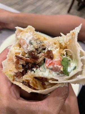 Taking a bite of my carnitas burritos!