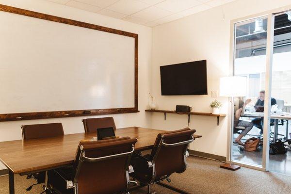 Private meeting room available to rent out by the hour. Includes video conference call, display and large whiteboard.