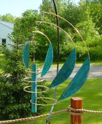 The outdoor Airdance in Copper & Brass is one of our best performing outdoor mobiles.   This is the Airdance in Patina.