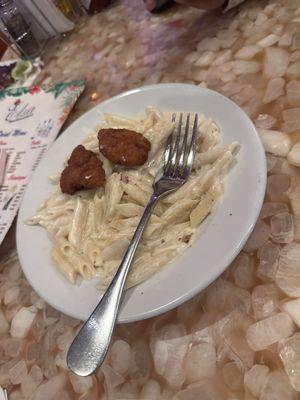 Pasta with Alfredo and chicken nuggets