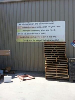 The "motto" sign board at the end of the Household Toxic Disposal & Recycling Area.