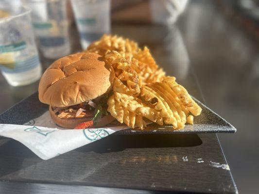 Salmon burger and waffle fries.