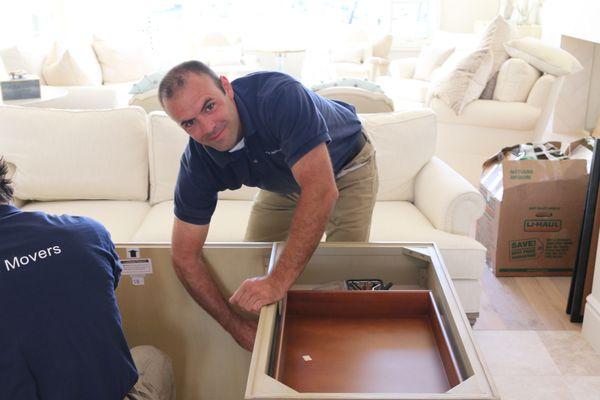 Matt from Sitter's Movers installing a desk for a customer