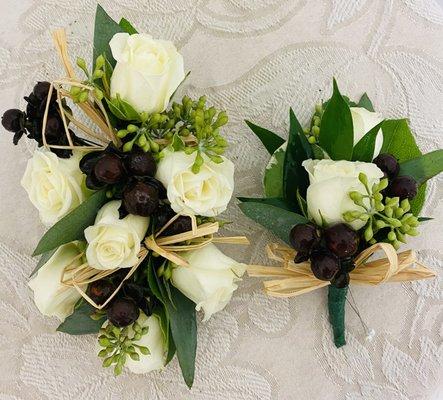 White rose, corsage seeded eucalyptus, and dark, brown coffee berry.$ $39.99 matching boutonniere $18.99