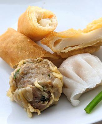 Pork dumpling with basil, never had it like this and pretty good. The eggroll and fried fishcake I thought were samples but we got charged