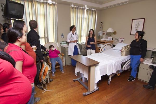 A group of expectant mothers and their families get a tour of the birthing center at St. Luke's.