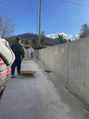 Corn hole and chalk wall