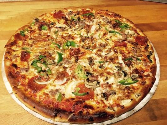 Works pizza (sausage, pepperoni, bacon, meatballs, onions mushrooms, green peppers)