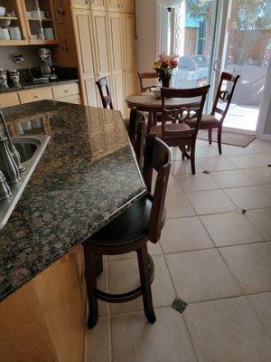 Kitchen floor and granite countertop.