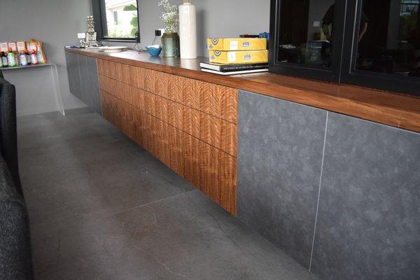 Grain matched drawers
 with metal doors.