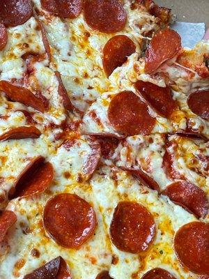 Close up of medium pepperoni pizza