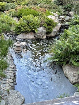 A calm pond at the bottom, "symbolizing hope and peace for the Sansei and future generations."