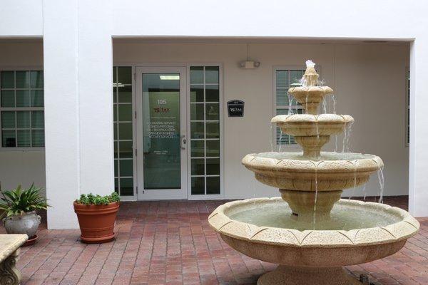 We're located in suite 105, In front of the fountain.