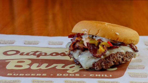 Zesty Bacon Onion smash with onion smash patty topped with bacon, cherry pepper relish, Alpine  sauce and pepper jack cheese