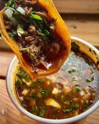 Taco de birria with delicious consome in portland oregon