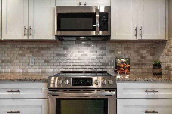 Remodeled Kitchen with beautiful tile backsplash