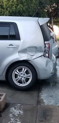 Damaged left rear quarter panel.