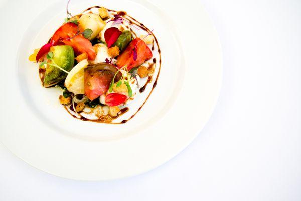 Organic Heirloom Tomato and Buratta Salad with Basil Pesto and Balsamic Reduction