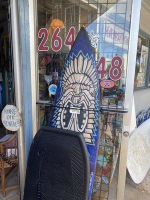 Surf board at entrance of store