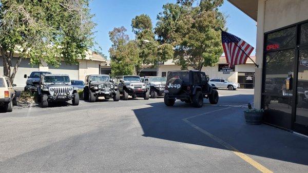 My Jeep dropped off by the tow truck outside the shop.