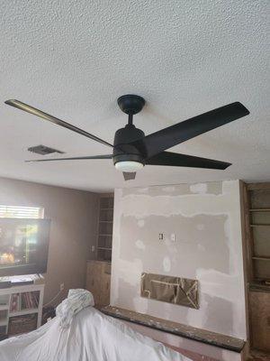 Fireplace covered with sheetrock.