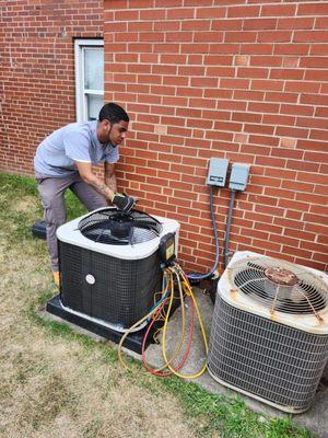 The Franklin team repairing an A/C unit at a residential home.