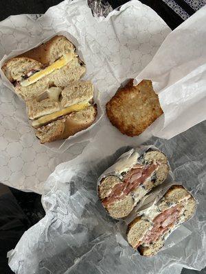 Bacon, egg, and cheese on an onion, bagel. Lox with roasted garlic and chive cream cheese on poppyseed bagel.